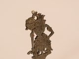 statue of a man riding a horse on top of a metal base