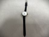 a watch that is laying on a table