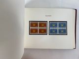 a book with a picture of two stamps on it