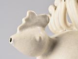 a close up of a sculpture of a horse on a table