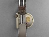 a watch that is attached to a wall with a key