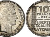 a silver coin with an image of a woman ' s head on it