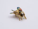 a close up of a small insect on a white surface
