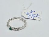 an image of a diamond and emerald ring with a price tag