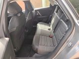 the back seats of a car with a seat belt in the back