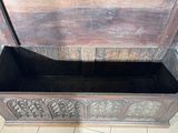a wooden box with a lid that has a design on it