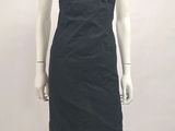a mannequin wearing a black dress on a mannequin stand
