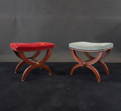 a pair of small stools with red and blue upholstered seats