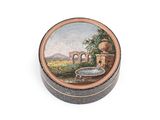 a small box with a painting on it on a white surface