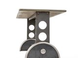 a metal table with two circular holes on it