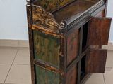 a small wooden cabinet with a drawer on top of it