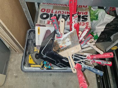 a lot of tools that are sitting in a bin