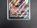 a close up of a pokemon card in a plastic case