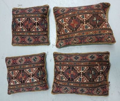 four antique persian rug pillows