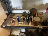 a shelf that has many different types of jars and jars on it