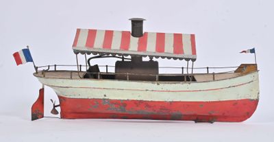 un bateau rouge et blanc muni d'un auvent rouge et blanc