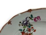a plate with flowers on it on a white background