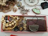 a pink box filled with assorted items on a table