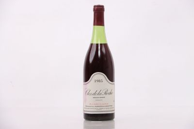 a bottle of wine that is sitting on a table