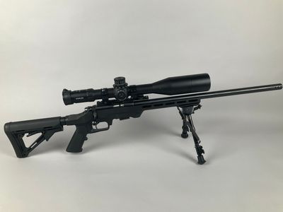 a rifle with a scope and a scope scope on it