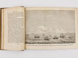 an open book with a picture of a mountain in the background