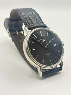 a close up of a wrist watch with a black dial