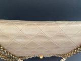 a close up of a purse with a chain around it