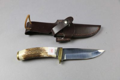 two knives that are sitting next to each other on a table