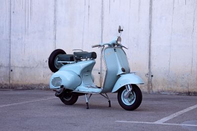 a scooter that is parked in a parking lot