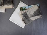 many old photos on the table with a black and white photo