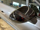 a close up of a car ' s side mirror with a sticker on it