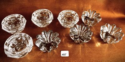 six glass vases sitting on a table with a gold background