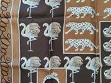 brown and blue scarf with elephants and giraffes on it