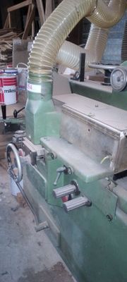 an image of a machine that is working on a piece of wood