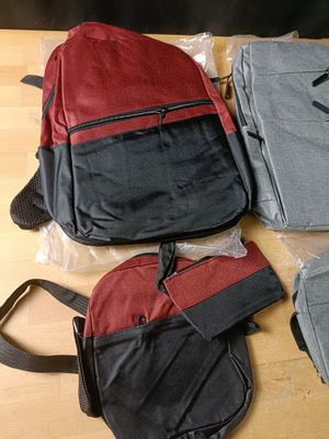 three bags of luggage sitting on top of a table next to each other
