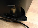 a black computer monitor sitting on a wooden desk
