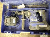 a blue tool box with a hammer, drill, and other tools in it