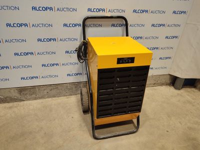 une image représentant une machine jaune et noire posée devant un mur