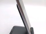 a cell phone that is sitting on top of a stand