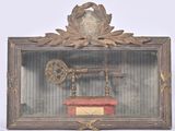 a picture of a clock and a key in a shadow box