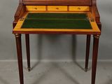an image of a small desk with a drawer on top of it
