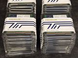 several stacks of cards sitting on top of each other on a table