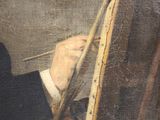 painting of a man holding a brush and painting a picture on a easel