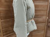 an image of a mannequin with a jacket on a mannequin stand