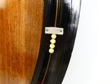 a close up of a wooden clock with beads on it