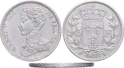 a close up of a silver coin with a crown on it