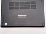 a black laptop with a blue sticker on it