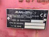 a sign on the side of a pink truck