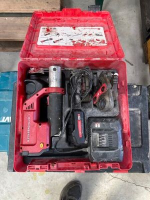 a red box with tools in it on the floor