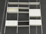 an overhead view of a parking lot with a white shelf and cabinets